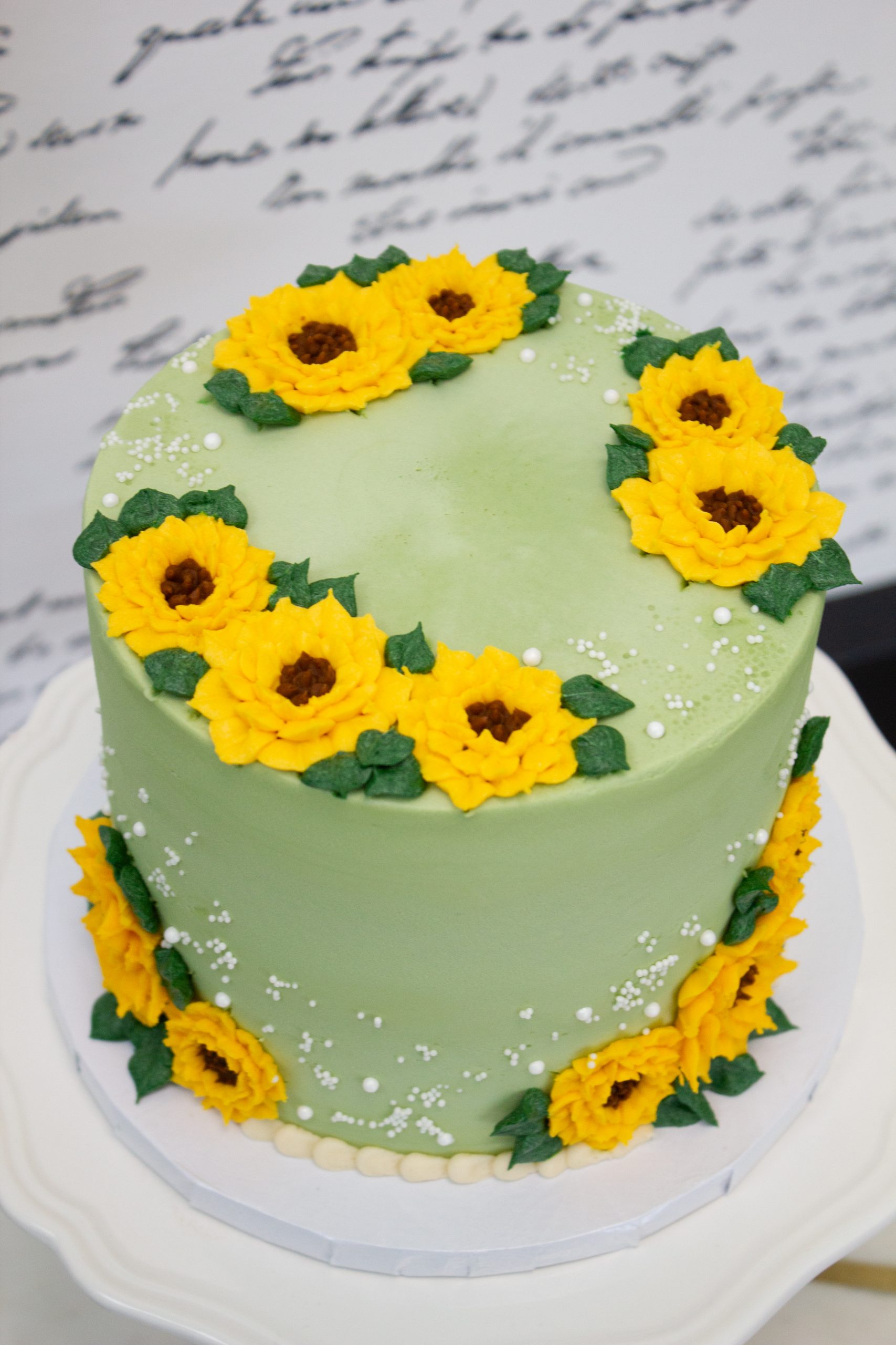 sunflower cake - Sweet Frostings Blissful Bakeshop - Beautifully decorated  with bright sunflowers., image size:1707x2560